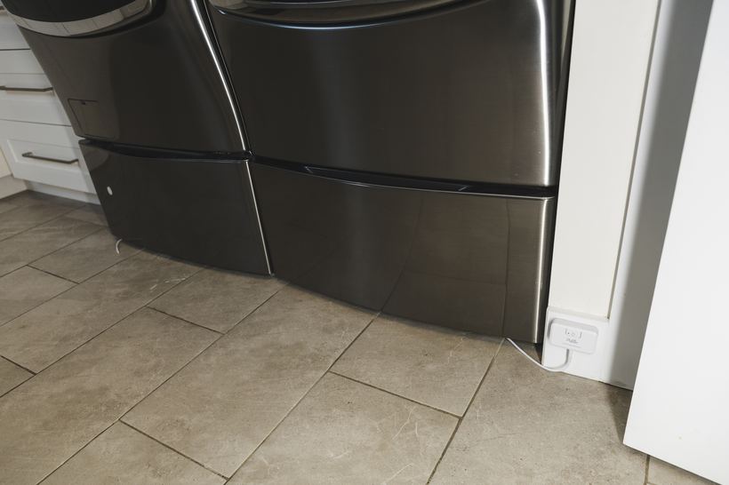 PuzL Detect mounted low beside a washer and dryer